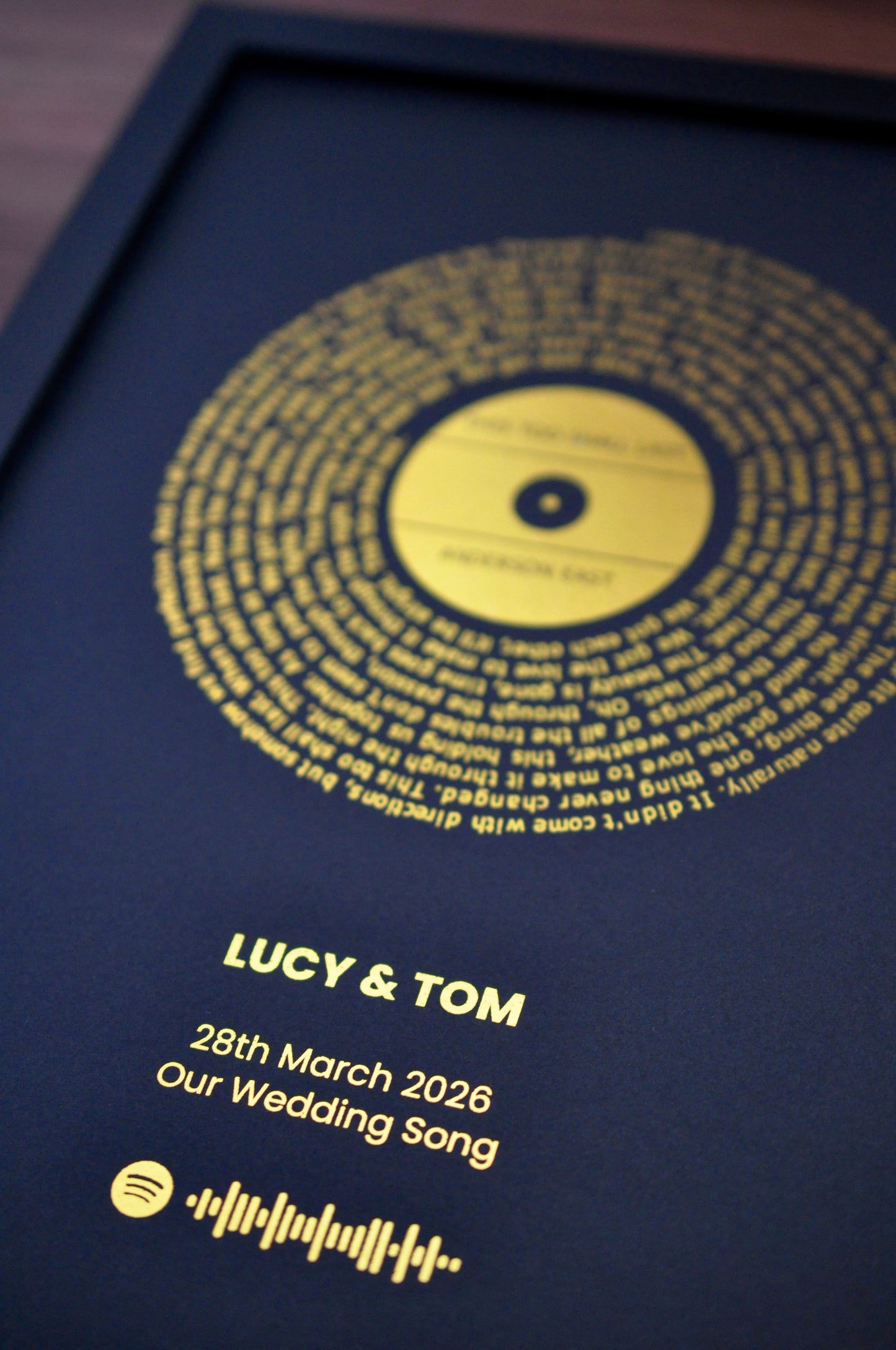 Personalized wedding gift with gold text on a black background