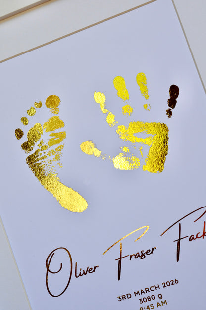 Gold foil hand and footprints on a white card with text
