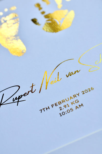 Baby birth details with gold text on a white background