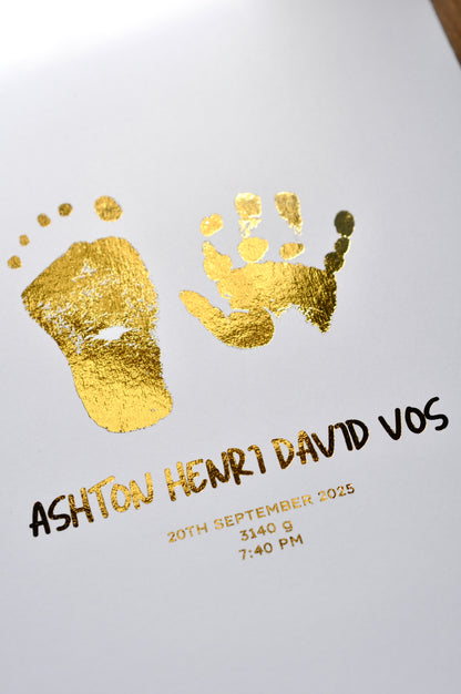 Gold foil hand and footprints with baby's name and birth details on a white background