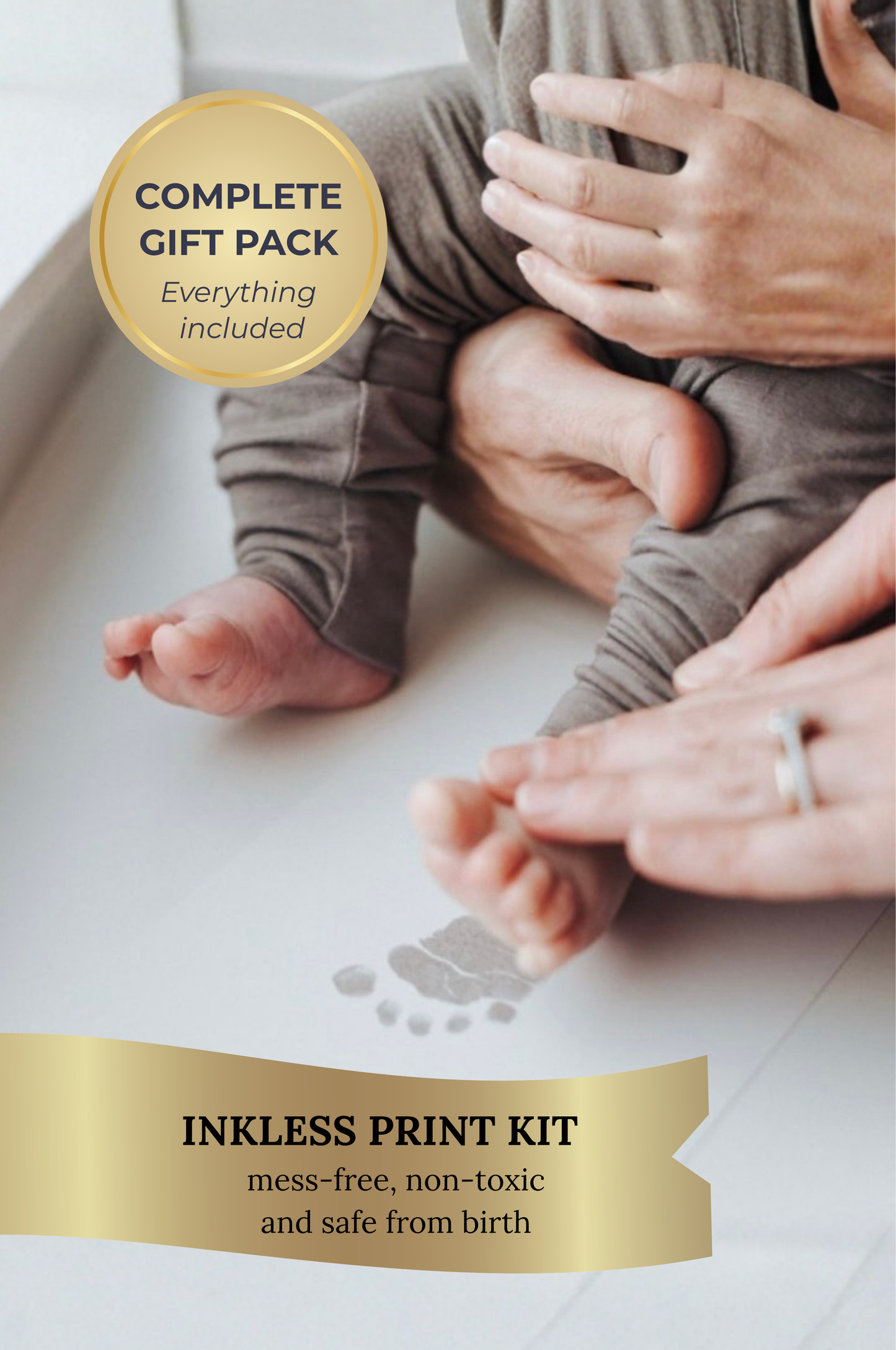 Baby's feet with inkless print kit application, showing a complete gift pack with everything included.