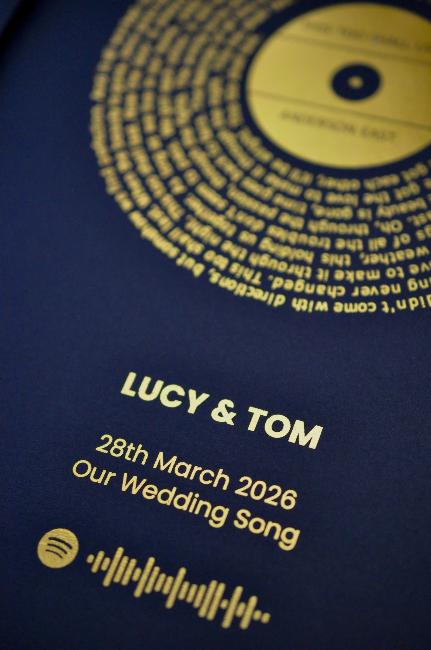 Personalized wedding gift with Spotify code and names on a black background